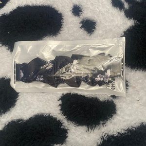 Black and purple floral Apple Watch band